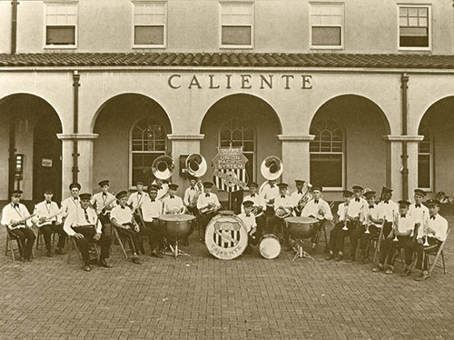 Sepia image of Caliente's band (which performed in the Rose Bowl Parade in 1930) in front of the Depot. ©Frank Scott Collection