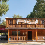 The front of an old wooden building, Hotel Lamoille