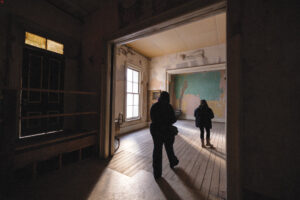 People walking in a room at the Washoe Club.