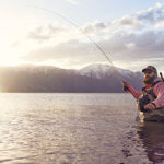 A man fishing in Washoe Lake