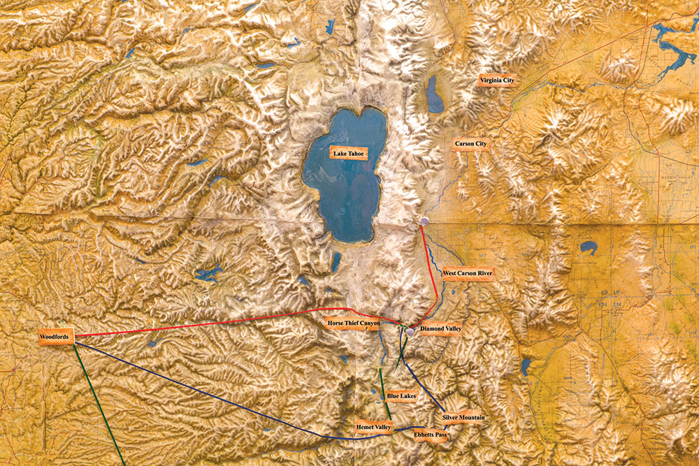 A relief map of the northern Nevada and California area surround Lake Tahoe shows some of Snowshoe Thompson's routes with different colored string. Some routes take you through Virginia City, Carson City, Diamond Valley, Horse Thief Canyon, Blue Lakes, Silver Mountain, Ebbetts Pass, Hemet Valley and out to Woodfords.