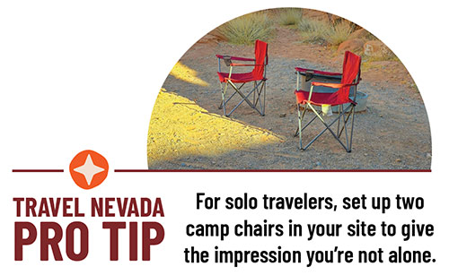 Two red camp chairs set up at a campsite. Travel Nevada PRO TIP: For solo travelers, set up two camp chairs in your site to give the impression you’re not alone.