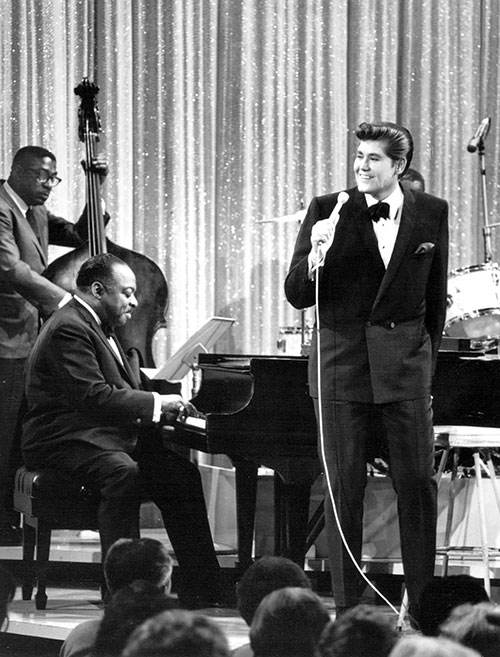 Historic photo of Wayne Newton singing with Count Basie on the piano