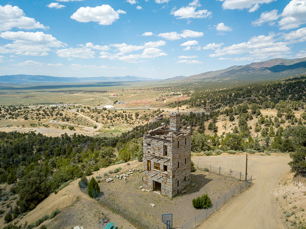 Drone photo of Stokes Castle, with the Reese River Valley in the background