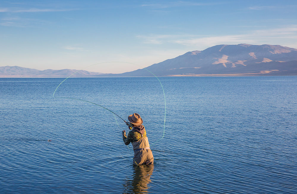 A woman fly fishing in Pyramid Lake