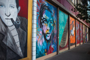 Series of murals along a building. 
