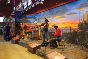 People viewing a display inside California Trail Interpretive Center.