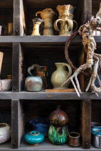 Various pottery vessels on a shelf. 