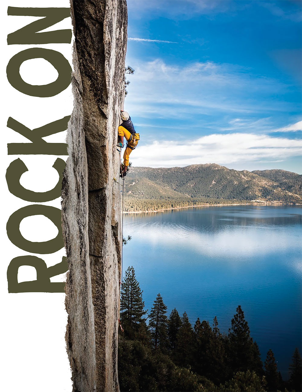A rock climber scales a vertical rock wall with Lake Tahoe in the background