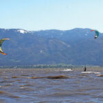 People parasailing on Washoe Lake